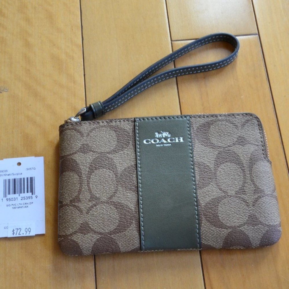 Coach Corner Zip Wristlet in Signature Canvas.